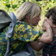 Emily Blunt puts her hand over a child's mouth to keep him silent in a A Quiet Place Part 2.